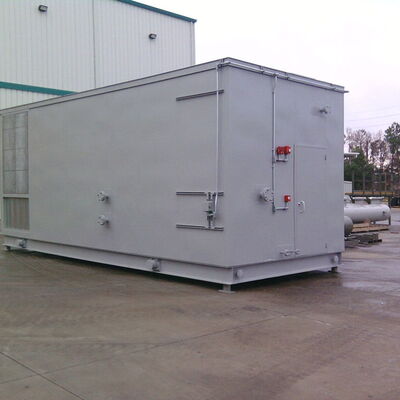 Large industrial gray equipment container in a commercial setting.