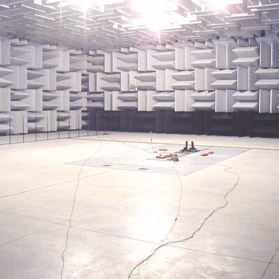 Anechoic chamber interior with sound-absorbing walls for acoustic testing.