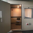 Soundproof room with a chair, designed for quiet environments.