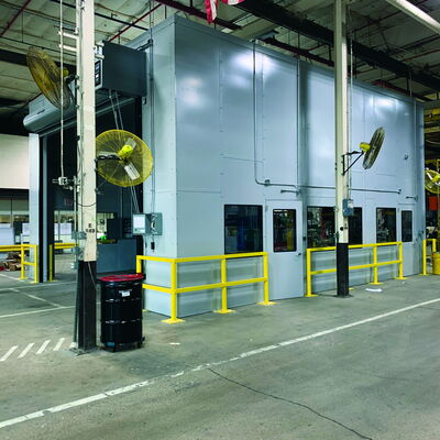 Industrial facility with safety features and American flag in background.