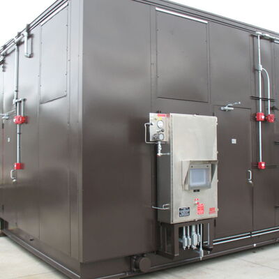 Industrial brown metal storage container with utility connections visible.