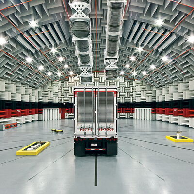 "Interior of anechoic chamber featuring sound-dampening structure and testing truck."