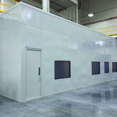 Modern cleanroom facility with smooth walls and large viewing windows.