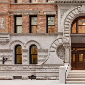 "Architectural details of historic building entrance in urban setting."