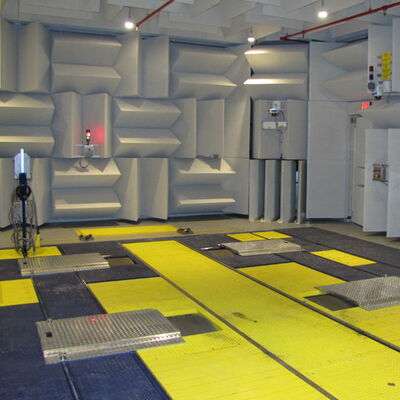 Anechoic chamber with specialized sound-absorbing walls and floor panels.