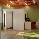 Modern office interior with a green color scheme and workspace design.