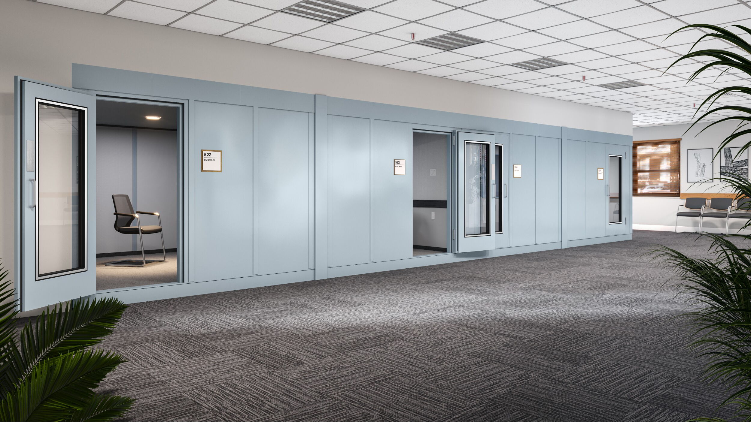 Modern office space with private booths and comfortable seating area.